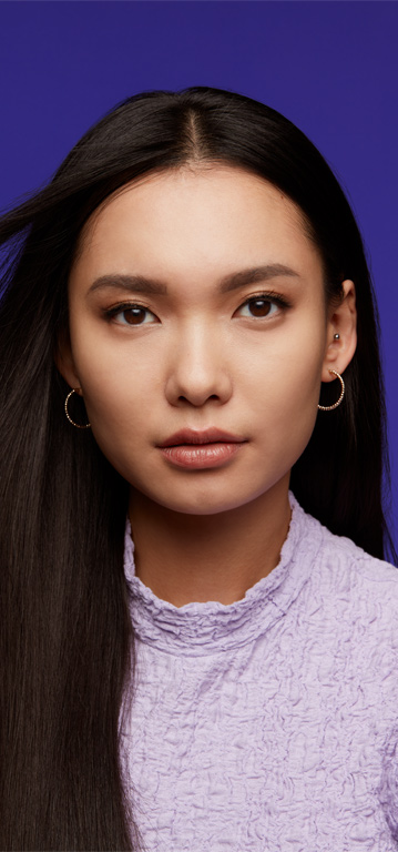 Woman looking at the camera with a neutral shade of Mary Kay Supreme Hydrating Lipstick